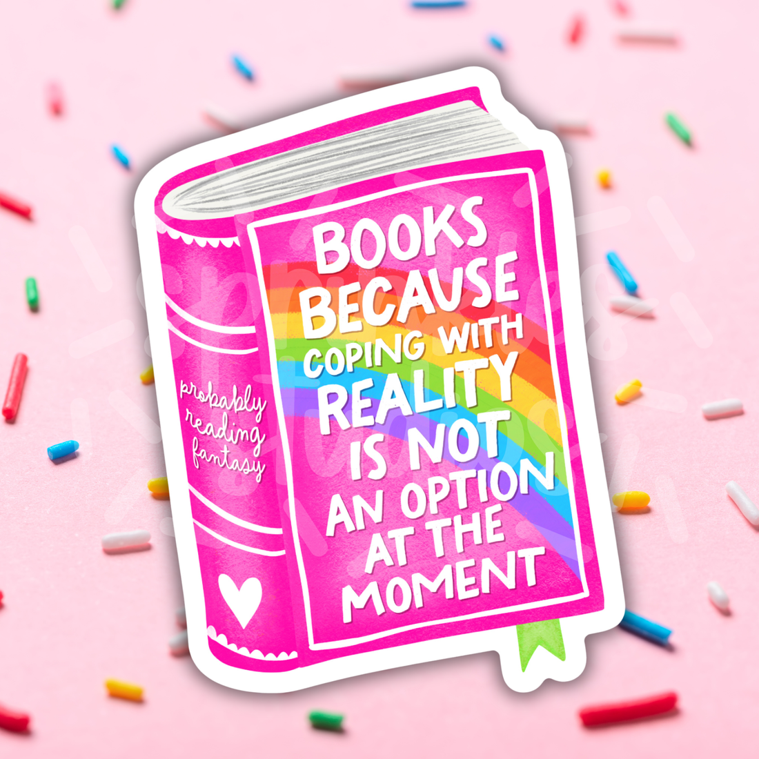 Sticker design of a book with colorful text on a pink background with sprinkles.