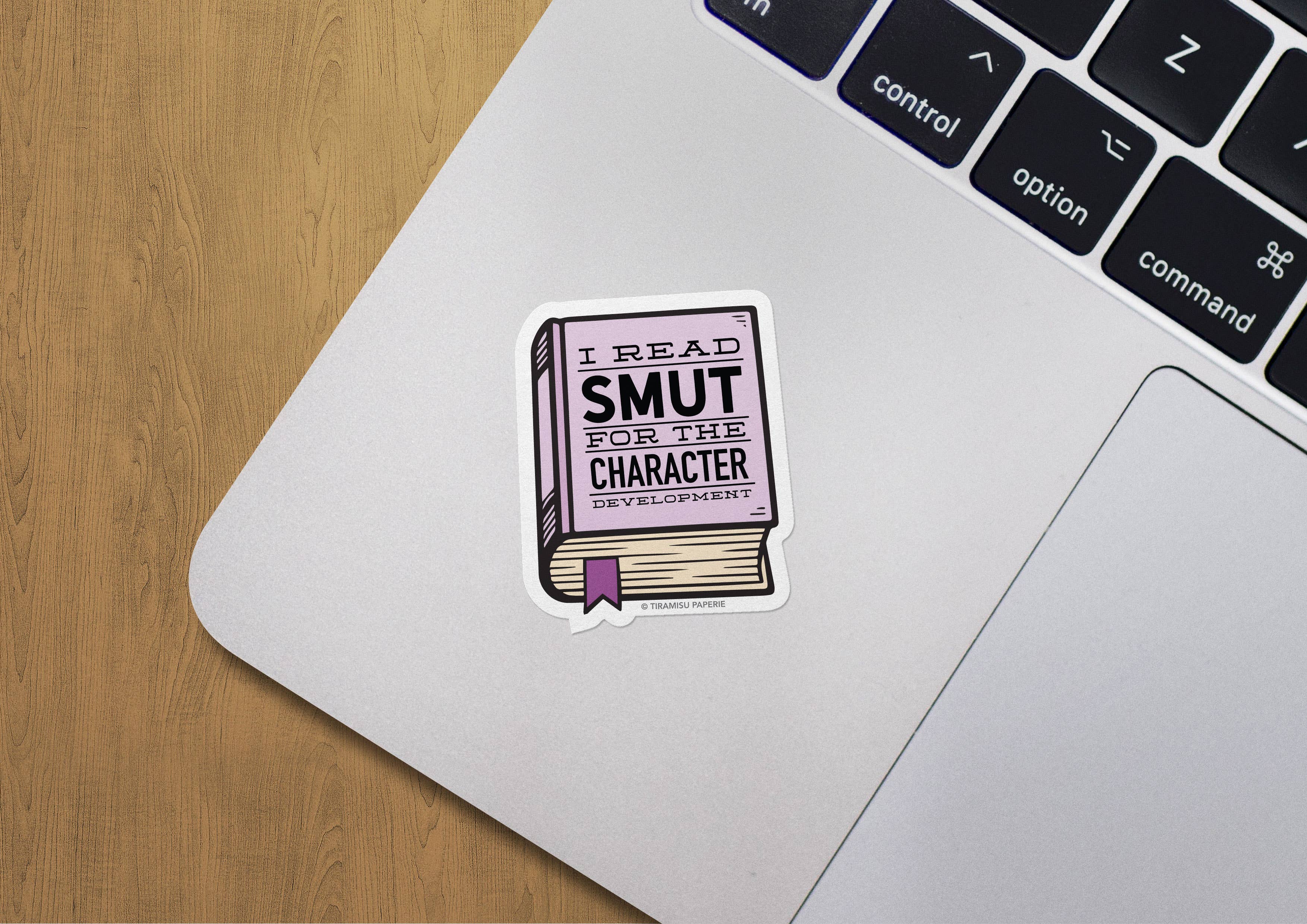 Laptop with a sticker reading &