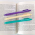 Three bookmarks with text on an open book