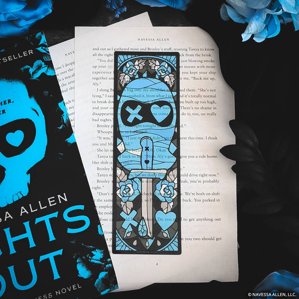 Decorative bookmark with blue and black design on a book page