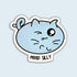 A die-cut sticker featuring a light blue cartoon cat face with one winking eye and the text &