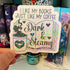 A hand holds a die-cut sticker featuring a glittery white background with the text &
