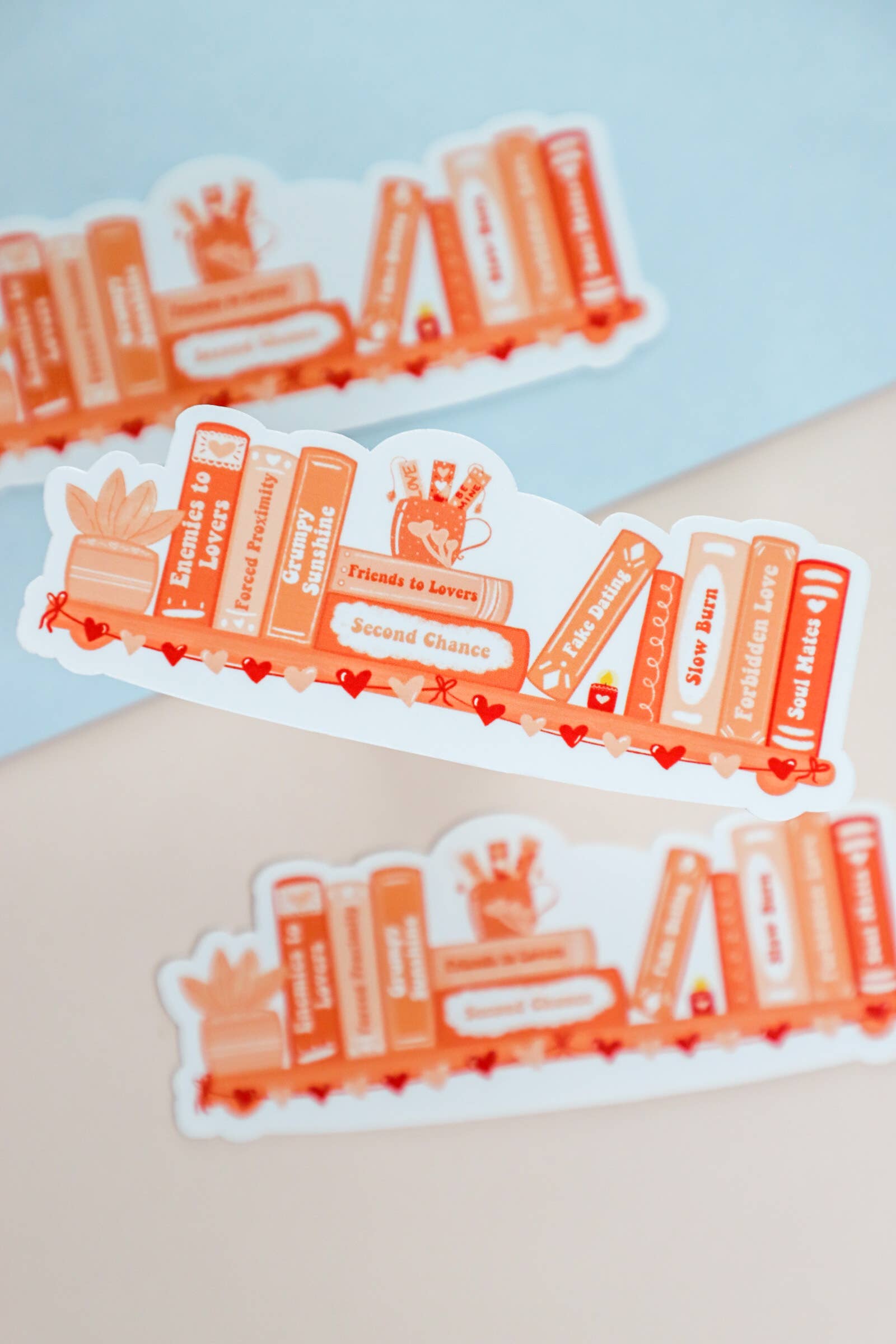 Set of orange and white stickers with text on a light blue background