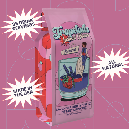 Tropetails Instant Cheer Instant Drink Mix package on a pink background with text about servings, origin, and ingredients.