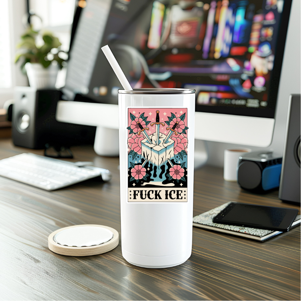 White tumbler with a graphic design on a desk in an office setting