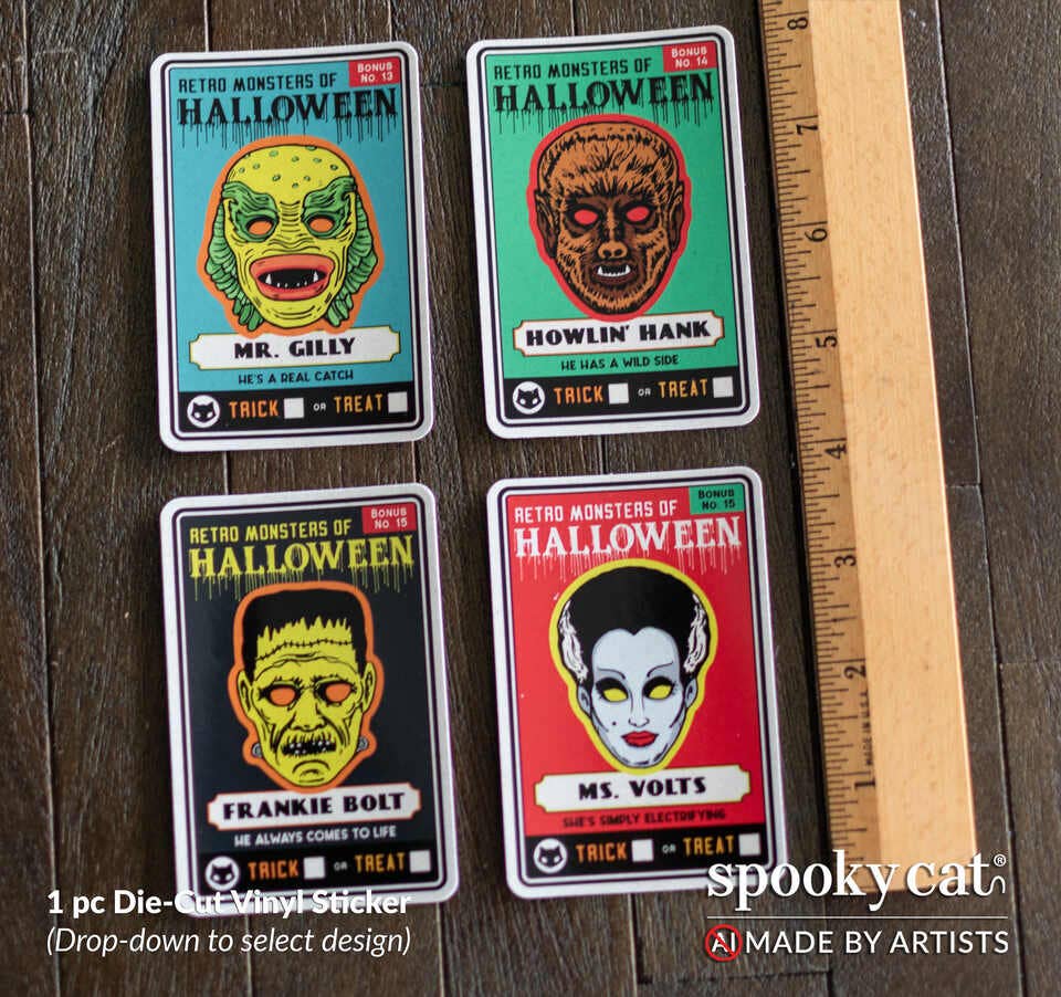 Four Halloween die-cut vinyl stickers featuring retro monster designs laid out on a dark wood surface next to a wooden ruler for scale. The stickers include Mr.