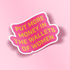 A die-cut sticker with a pink background and bold yellow text reading &