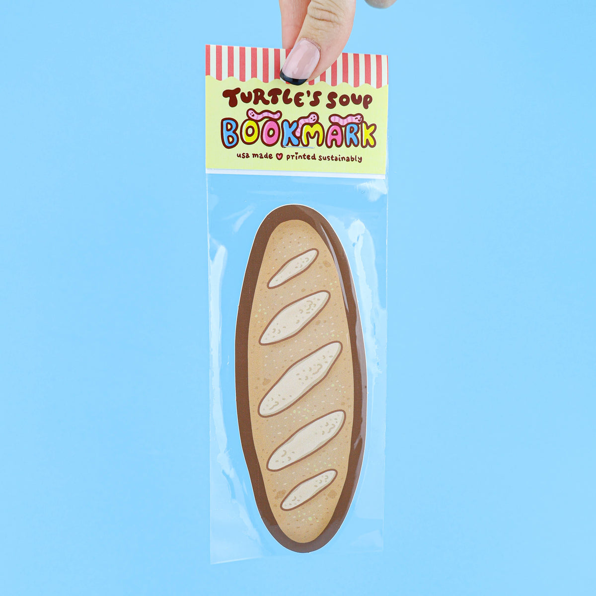 Bookmark shaped like a loaf of bread in clear packaging with &