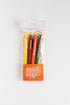 Pack of colorful pens with a clear plastic sleeve on a white background
