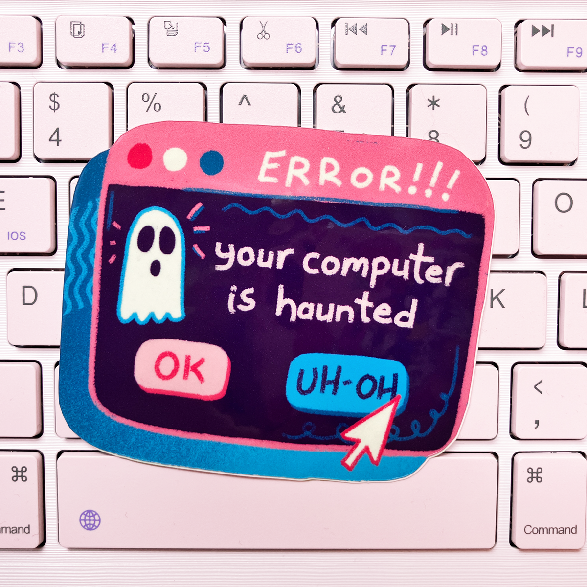 A novelty keyboard sticker shaped like a computer error window, featuring a ghost and the text &