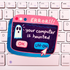 A novelty keyboard sticker shaped like a computer error window, featuring a ghost and the text &