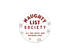 A round white sticker or label with the text &
