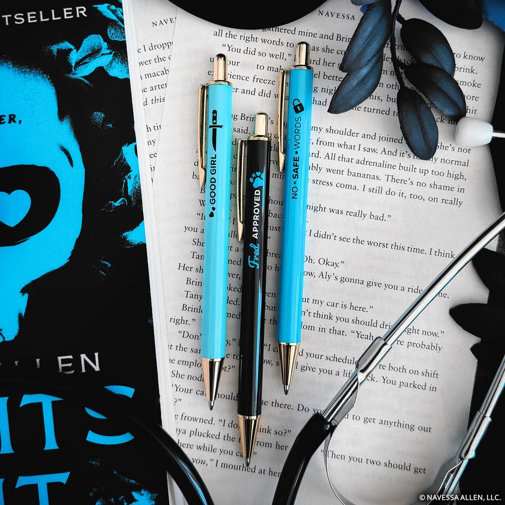 Three pens with blue accents on a book page