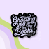 A die-cut sticker with the phrase &