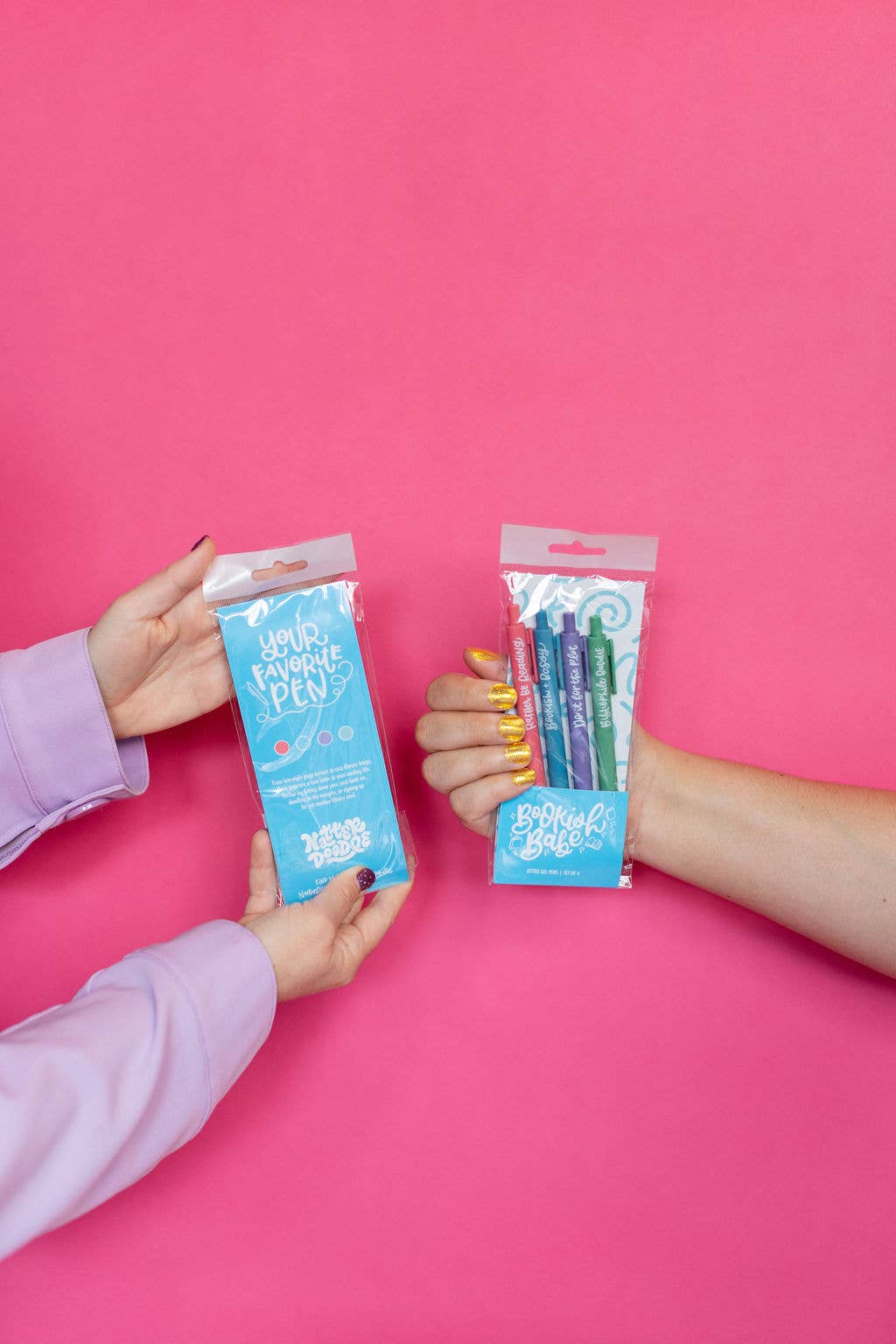 Two hands holding packages of &