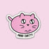 A die-cut sticker featuring a pink cartoon cat face with the text &
