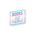 A die-cut sticker with the text &