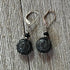 Fortune Stone Earrings featuring carved red jasper and black onyx, symbolizing luck and style.
