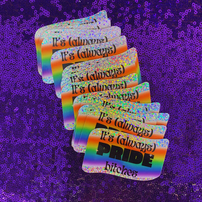 Stack of rainbow-colored stickers with text on a purple sequin background