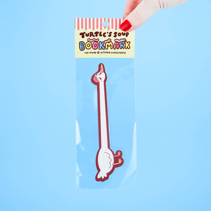 Bookmark shaped like a cartoon goose with a hand holding it against a blue background