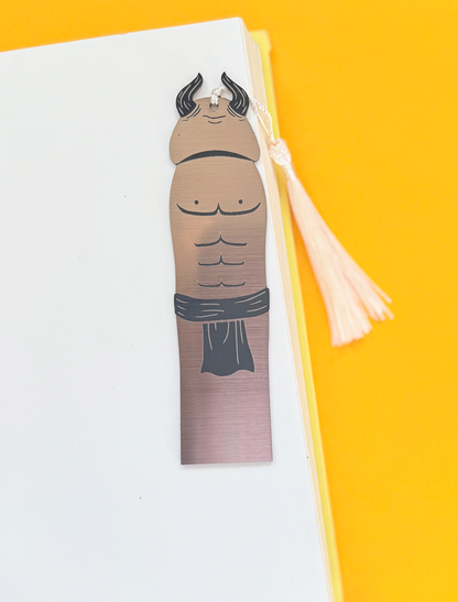 Bookmark with bull design on a white surface with a yellow background