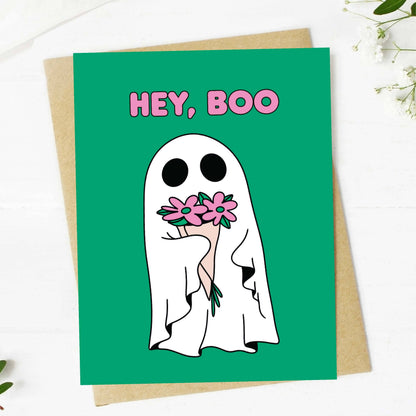 Greeting card with a ghost holding flowers and &