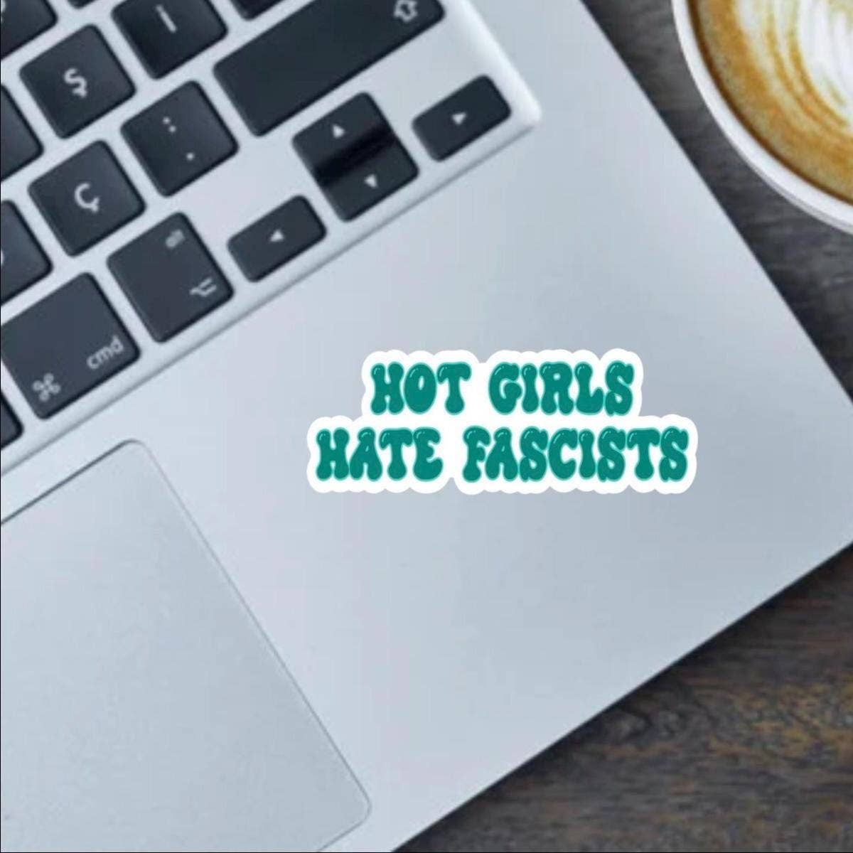 Laptop with a sticker reading &