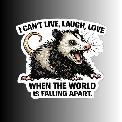 A die-cut sticker featuring a cartoon opossum with an open mouth and the text &