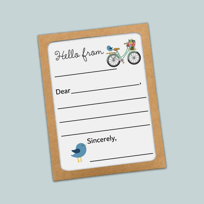 The image is a greeting card with a bicycle and a bird on it. The card has a blank space for a message and a blank space for a name.
