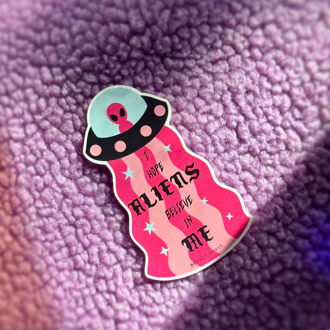 Sticker with alien design and text &