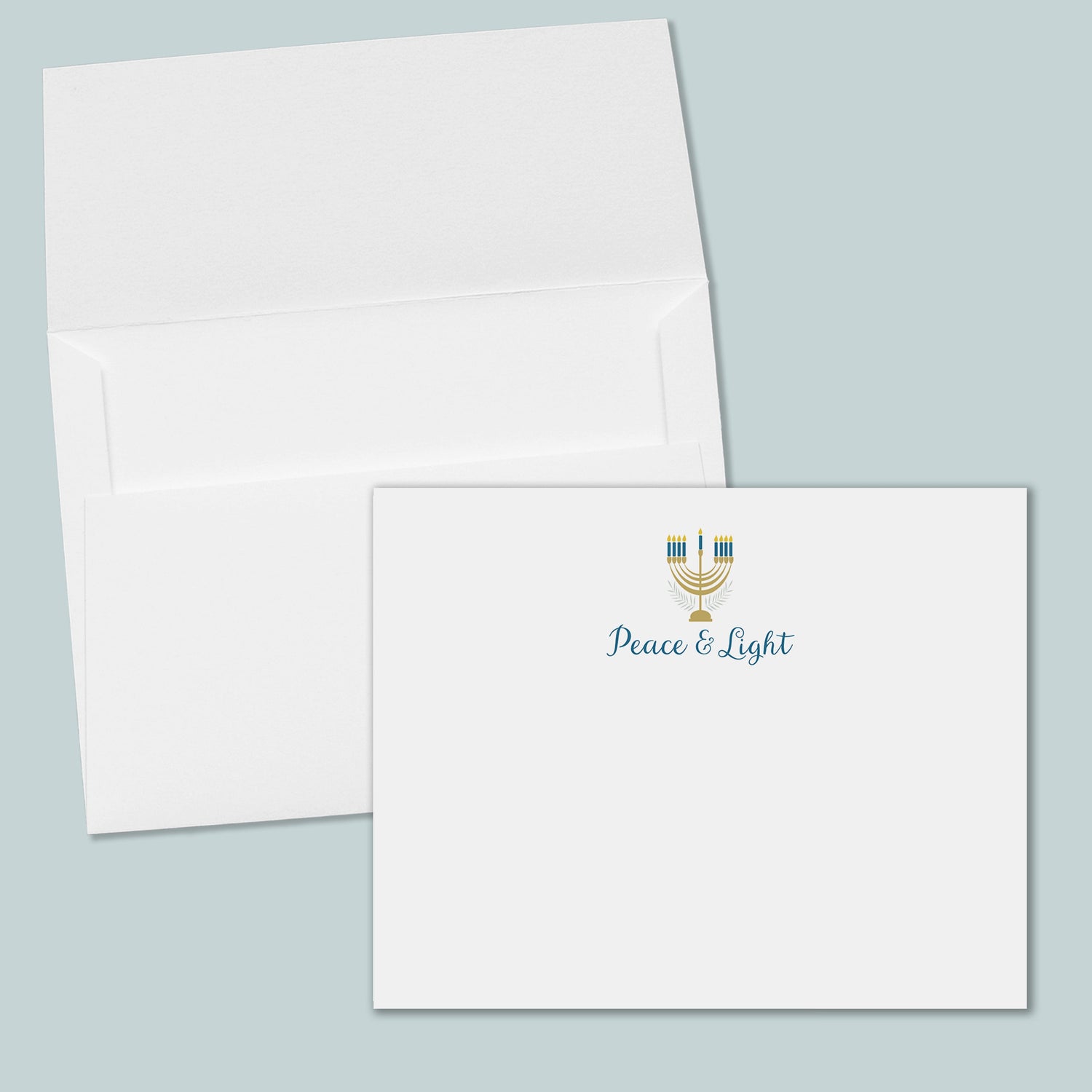 an open white envelope with a printed "Peace &amp; Light" logo on the front.