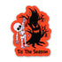 A Halloween-themed die-cut sticker featuring a white skeleton dancing next to a large black haunted tree on a bright orange background, with the text &