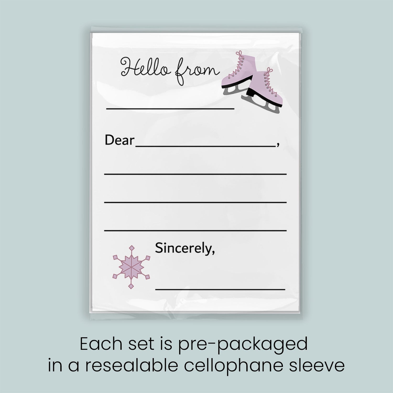 A pre-packaged letterhead set with a snowflake design and a pair of pink skates, indicating that each set is pre-packaged in a resealable cellophane sleeve.