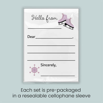 A pre-packaged letterhead set with a snowflake design and a pair of pink skates, indicating that each set is pre-packaged in a resealable cellophane sleeve.