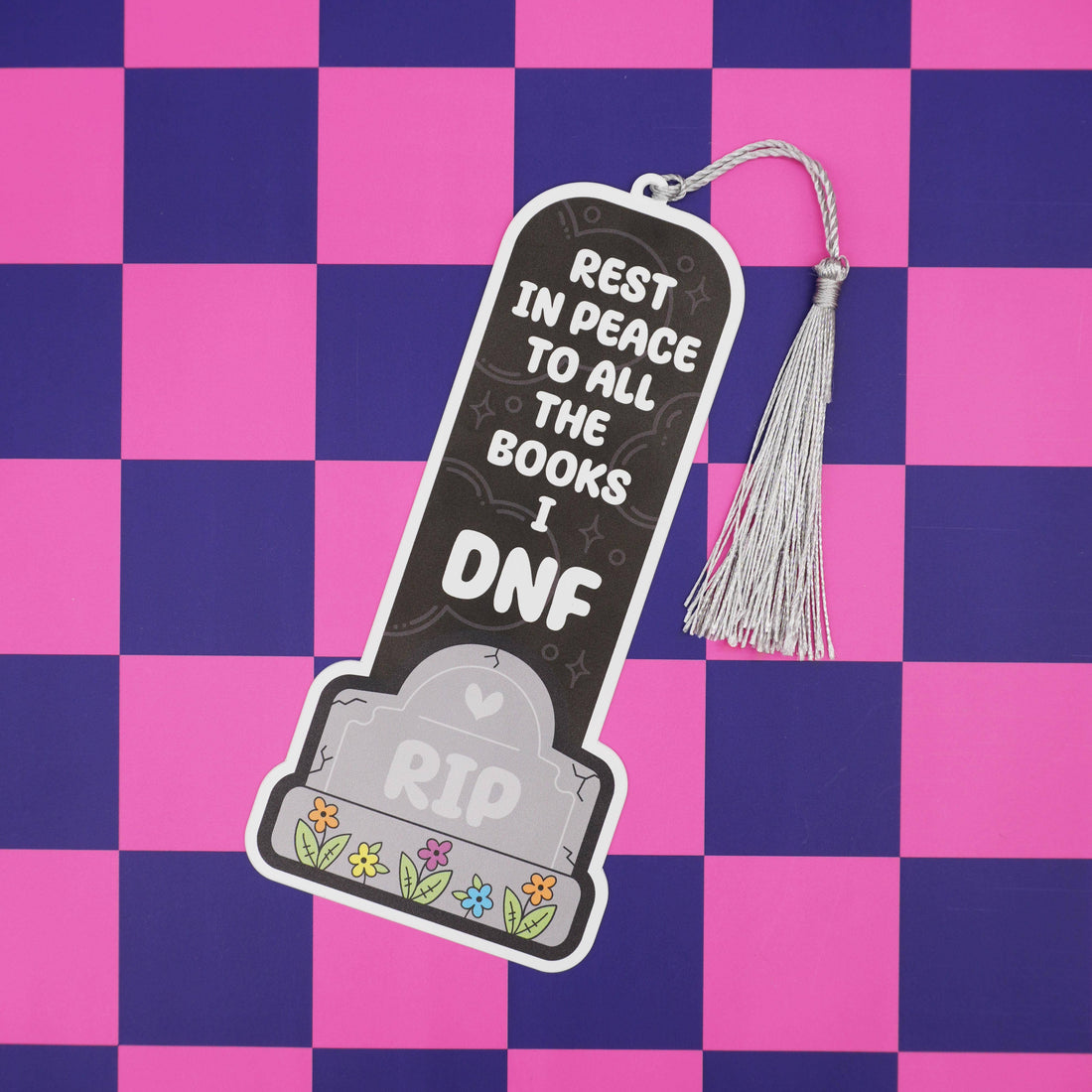 Bookmark with tombstone design and text on a pink and purple checkered background
