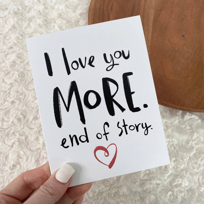Hand holding a card with &