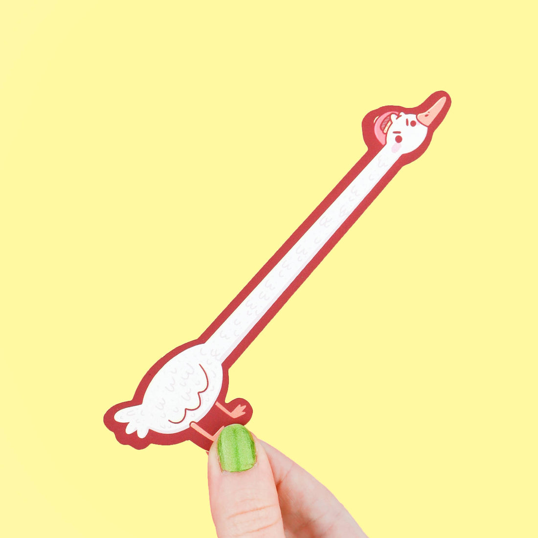 Goose-shaped bookmark with cartoon face on a yellow background