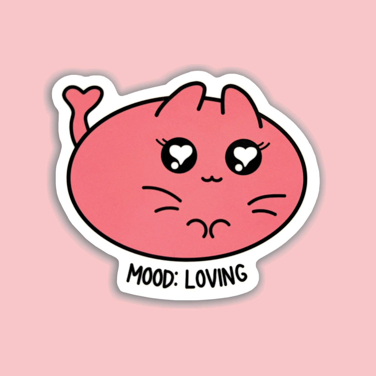 A die-cut sticker featuring a cute pink cartoon cat face with heart-shaped eyes and the text &