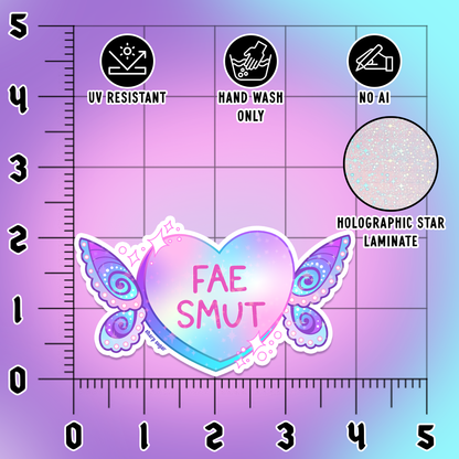 A sticker or decal design shown on a purple measurement grid background with ruler markings. The central product is a holographic heart sticker with pastel pink and blue iridescent shading, decorative butterfly wings on both sides, and the text &