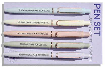 Set of pens with humorous quotes on a purple background