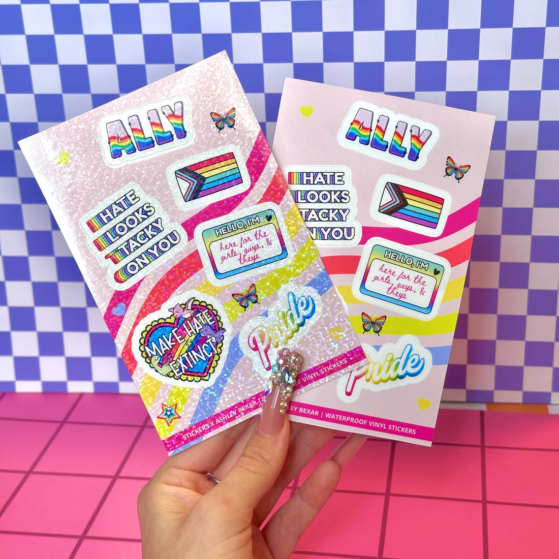 Two packages of colorful stickers with text and graphics on a checkered background