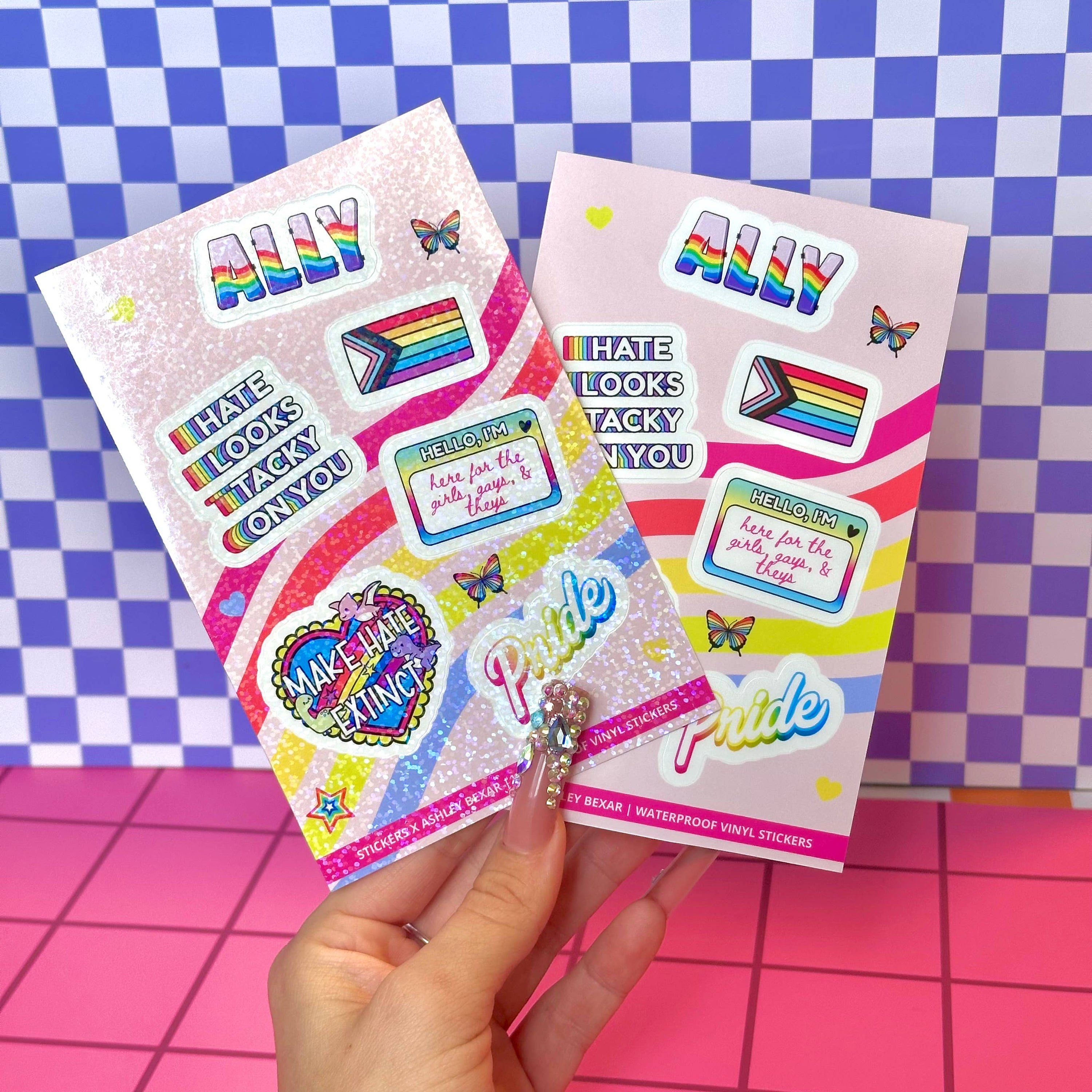 Two packages of colorful stickers with text and graphics on a checkered background