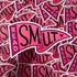 A close-up pile of die-cut stickers featuring the phrase &