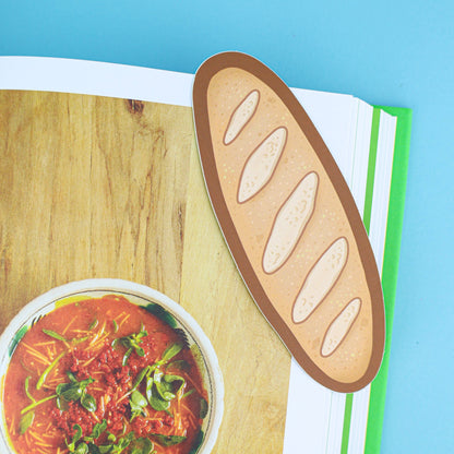 Illustration of a baguette and a bowl of soup on a wooden surface with a blue background