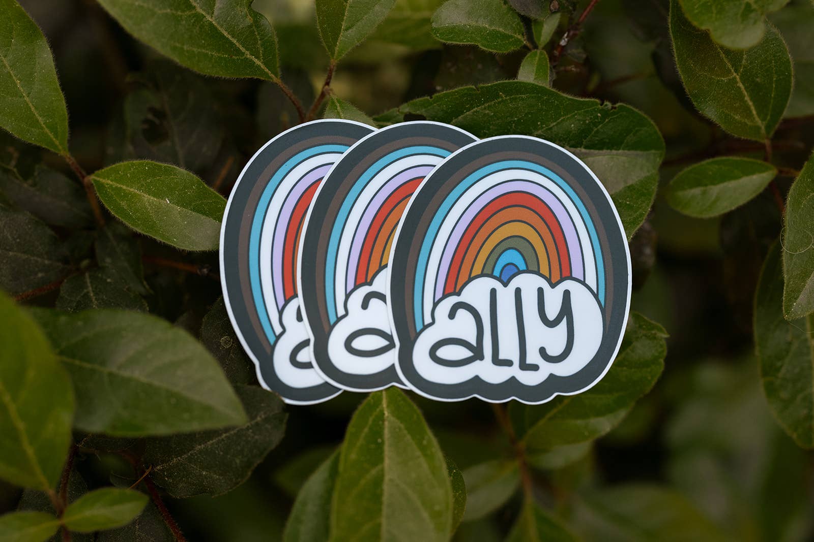 Three rainbow cloud stickers with &