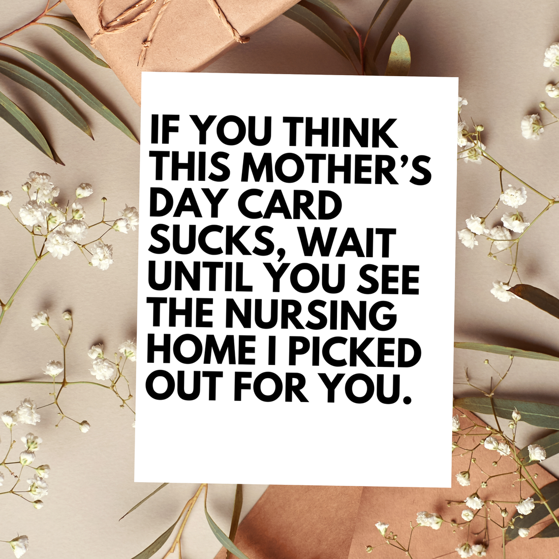 Card with humorous text on a decorative background with flowers and leaves.
