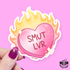 A die-cut sticker held by a hand with glittery purple nail polish. The sticker features a pink heart with the text &