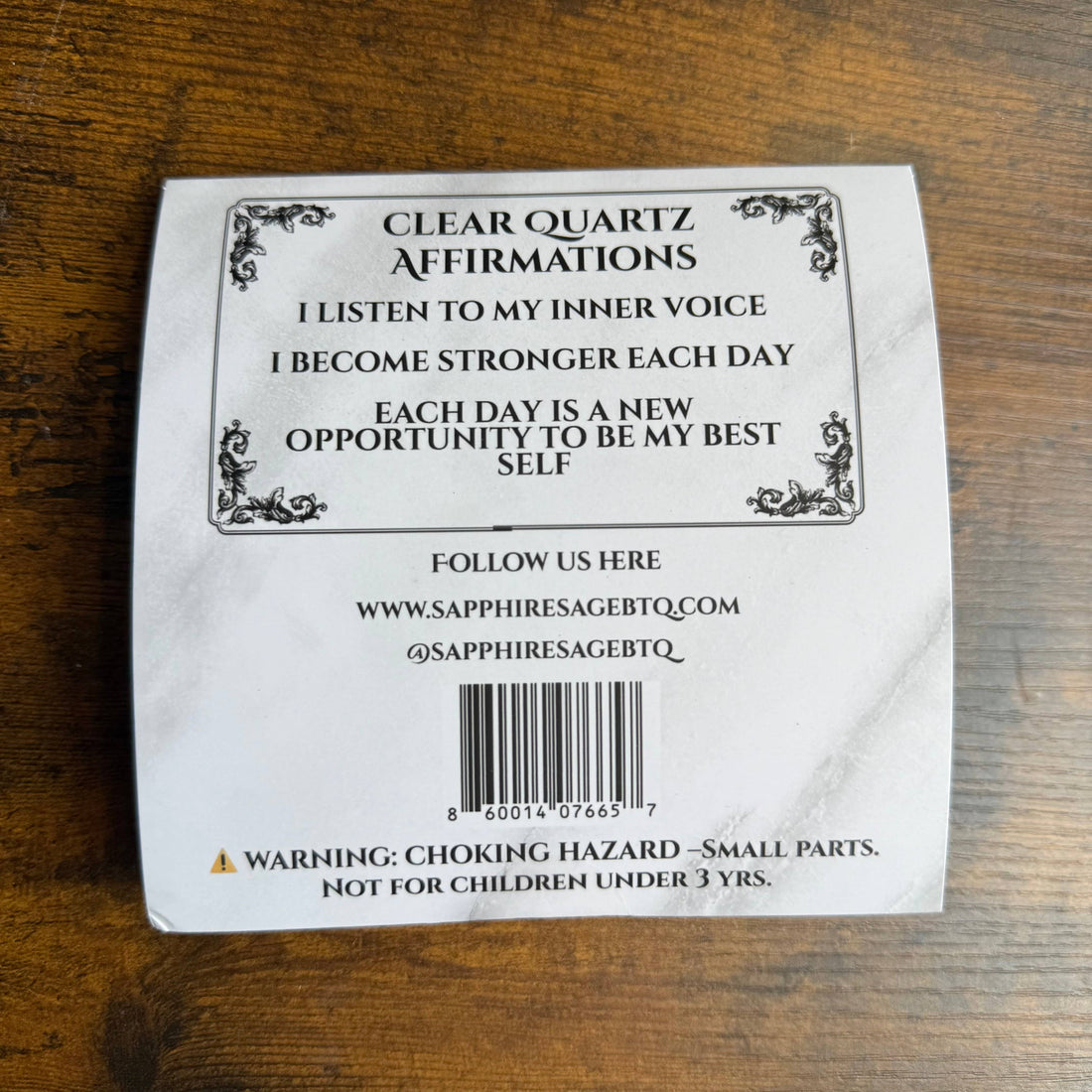 Clear Quartz Affirmations packaging with text on a wooden surface