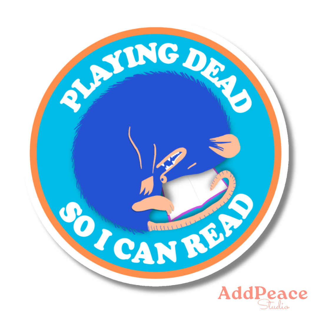 Circular sticker with blue character reading a book and text &