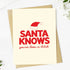 A Christmas greeting card with a kraft envelope, featuring the text &